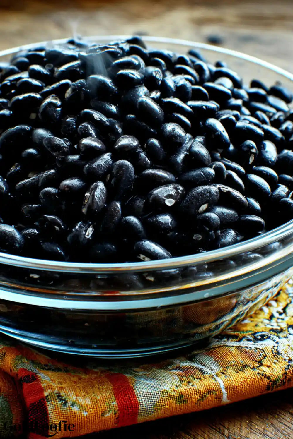 Black Beans – The Only Ingredient You Need Glass bowl filled with cooked black beans steaming