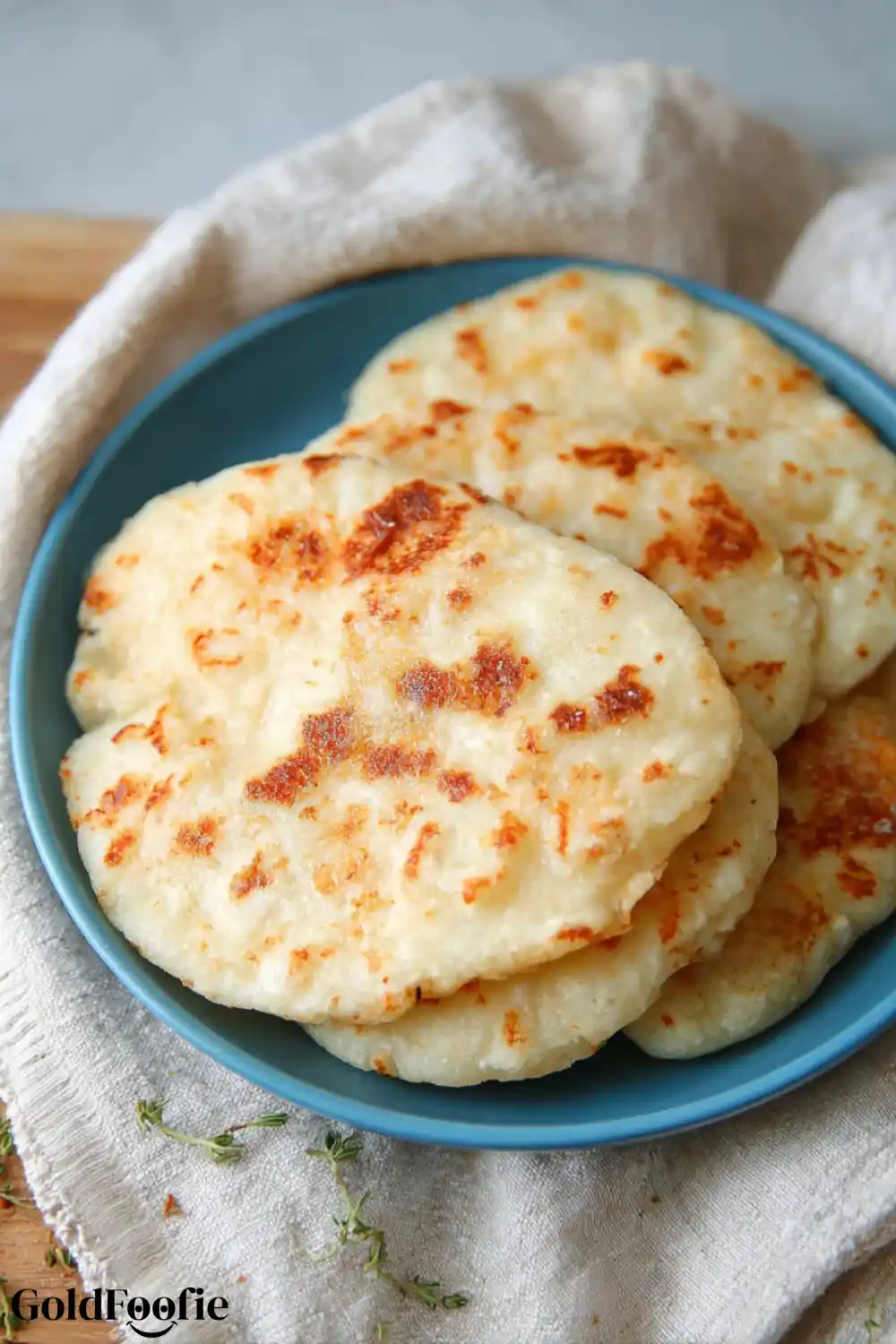 Cheese-Based Wraps Golden brown cheese-based tortillas on a blue plate