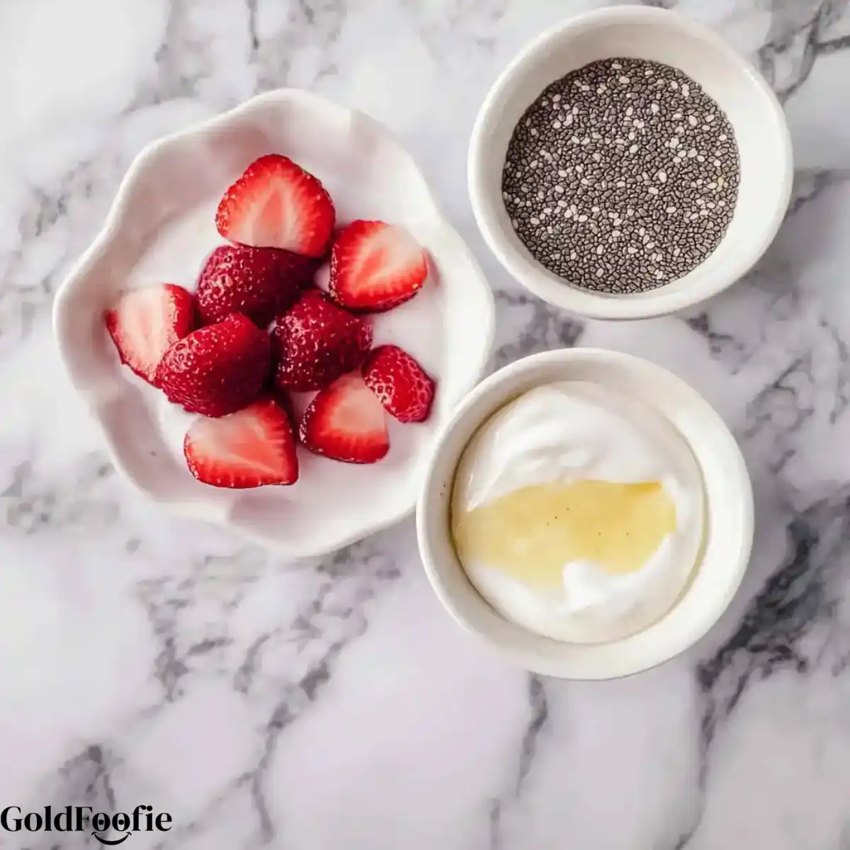 Chia Yogurt Ingredients Prep Bowl of strawberries, chia seeds, and yogurt with honey - Chia Seeds in Yogurt