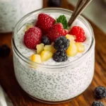 Yogurt chia pudding topped with fresh berries and pineapple