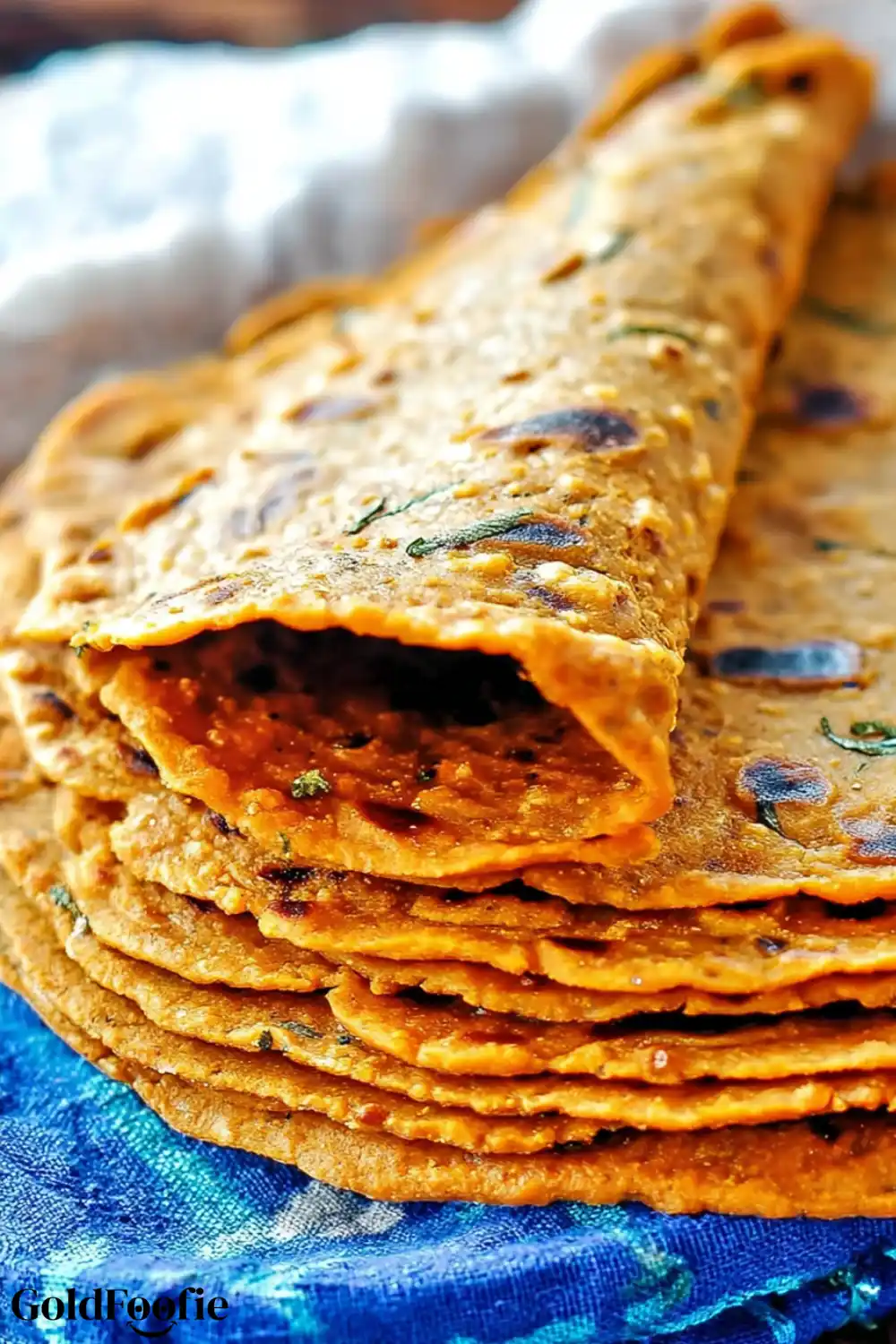 Freshly Cooked Sweet Potato Tortillas Homemade sweet potato tortillas stacked on a blue ceramic plate
