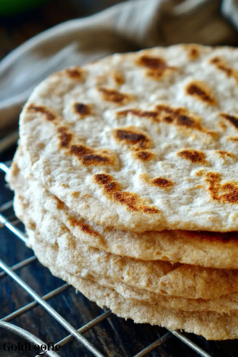 Freshly Grilled Coconut Tortilla – Golden and Flexible Cooked tortilla resting on cooling rack with golden spots