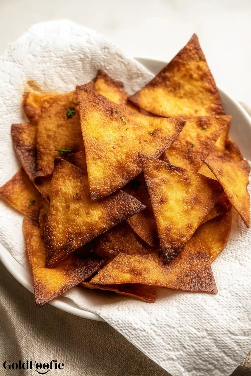 Fried Low-Carb Chips Cooling Before Serving Golden brown low-carb chips recipe draining on a paper towel
