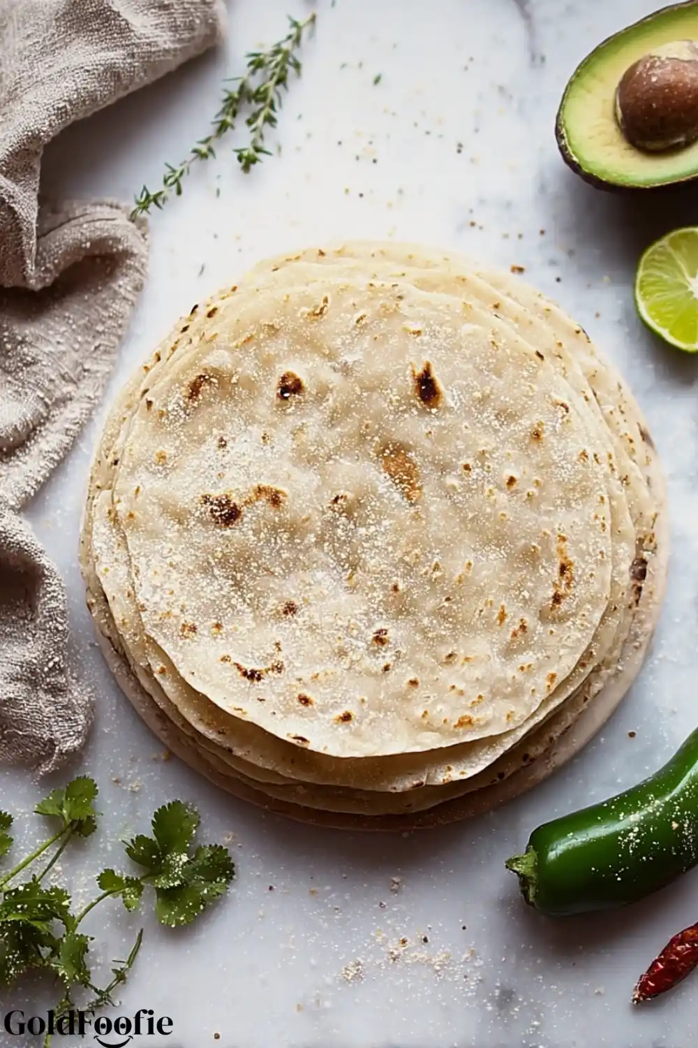 Gluten-Free Tortillas with Fresh Garnishes Overhead view of cooked gluten-free tortillas with avocado and herbs