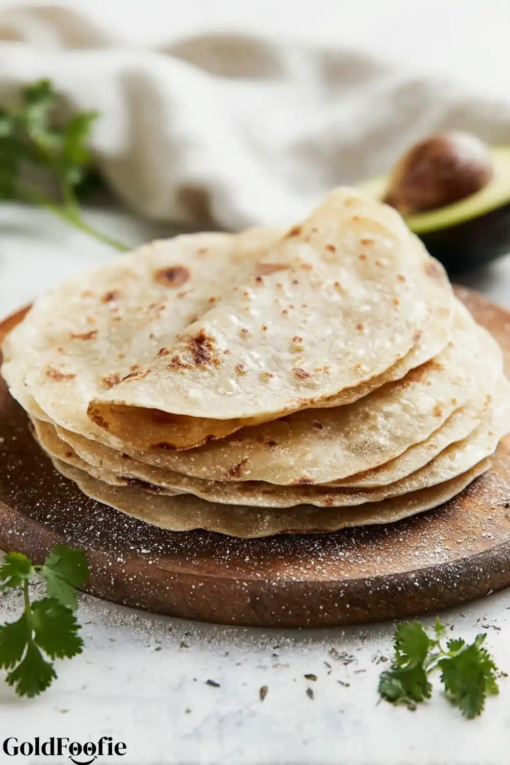 Homemade Gluten-Free Tortillas Stack Folded gluten-free tortillas stacked on a wooden board