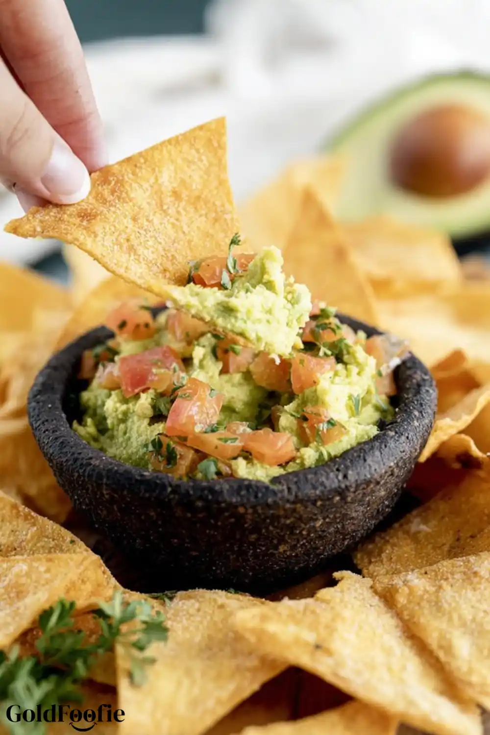 Keto Chip with Guacamole Dairy-free keto chip scooping guacamole