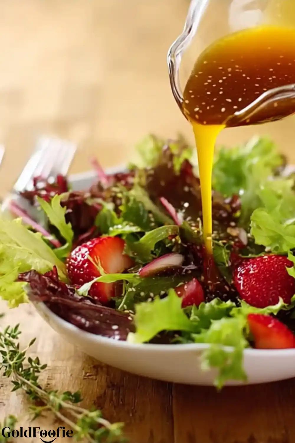 MCT Oil Salad Dressing Recipe 6 MCT Oil Salad Dressing poured over strawberry salad