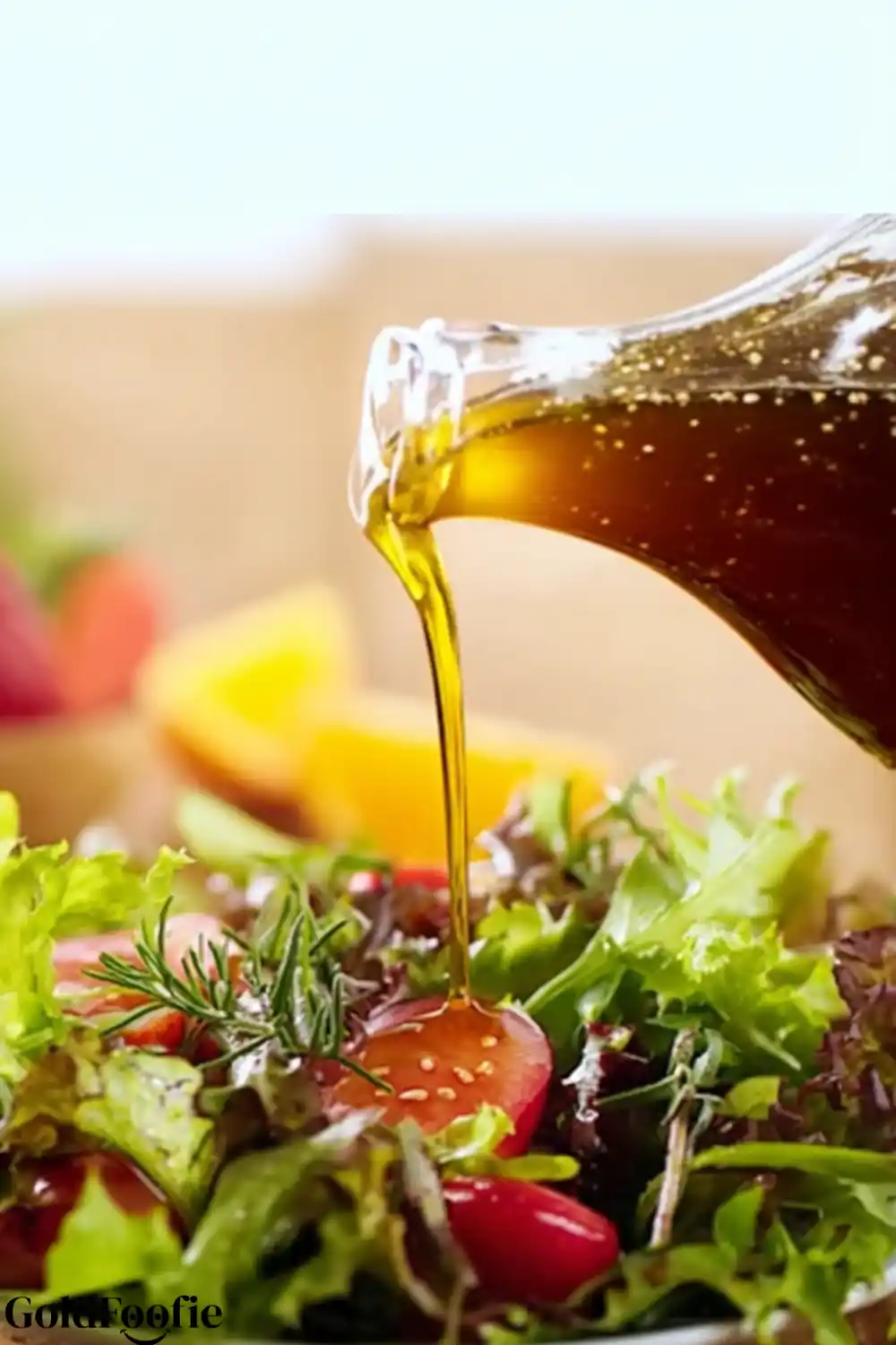 Metabolic-Boosting Salad Dressing Vinaigrette being poured onto a fresh green salad