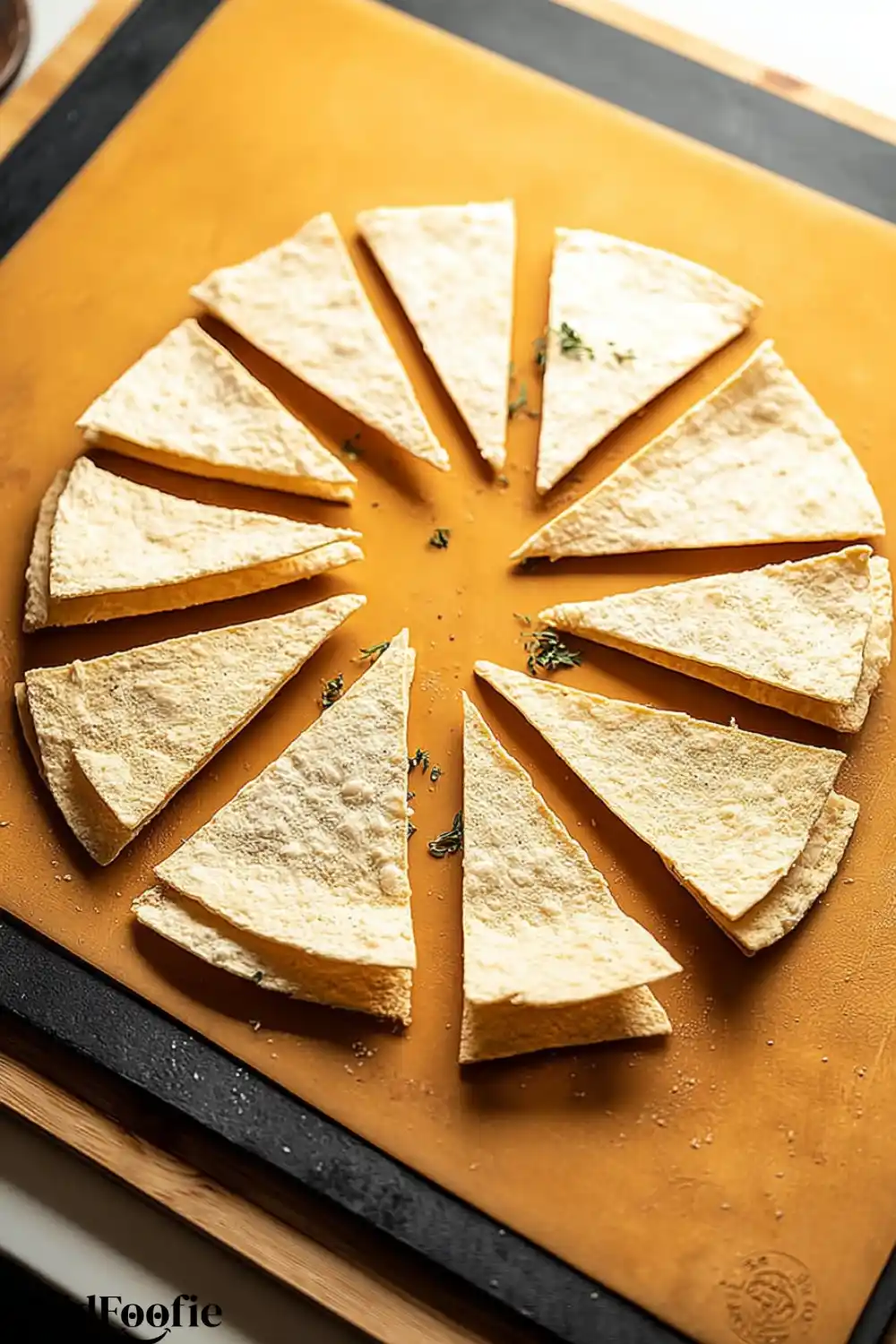 Preparing Low Carb Tortilla Chips Stacked tortillas cut into triangles before baking