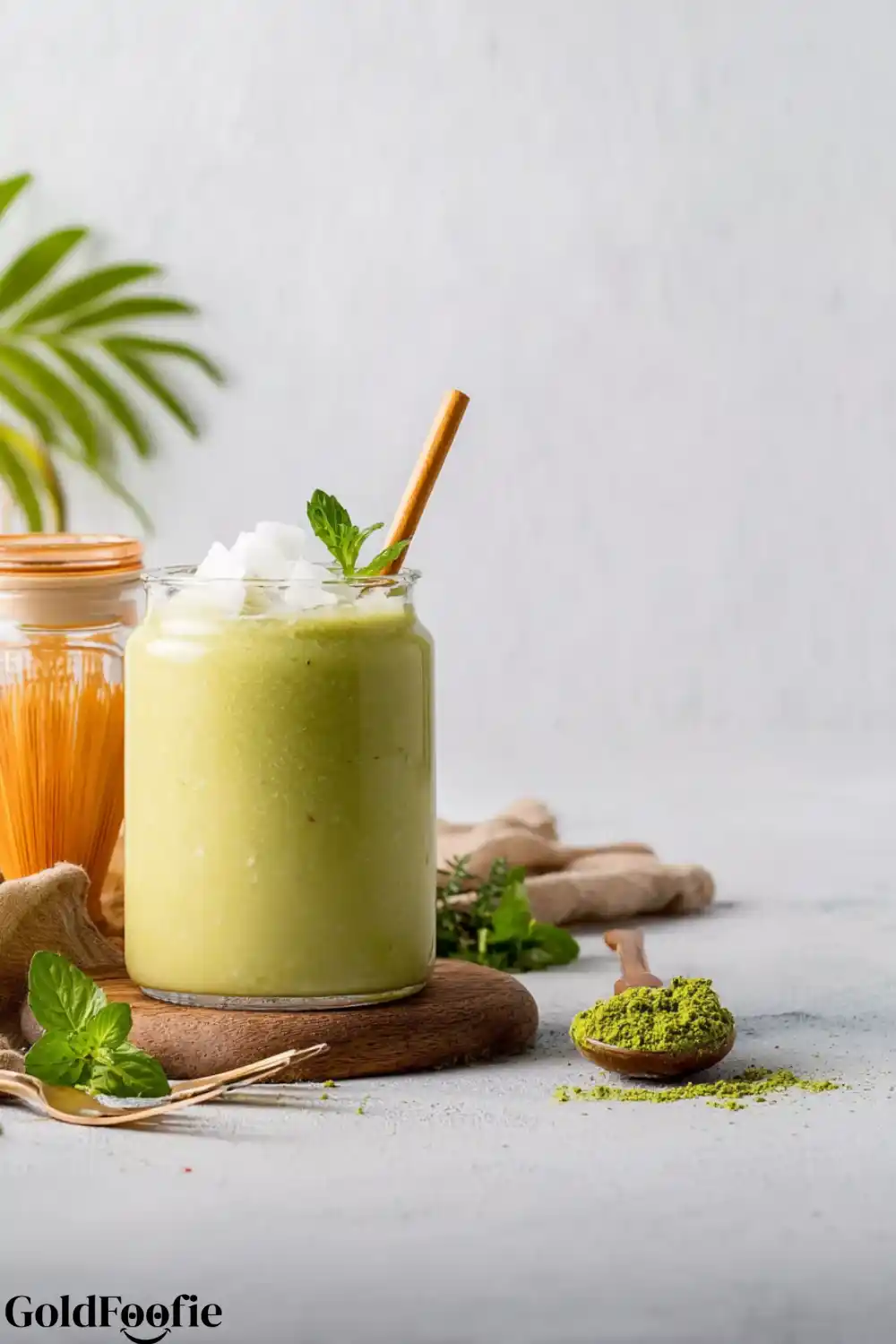 Electrolyte Replenishing Smoothie 5 Electrolyte-replenishing green smoothie in a glass jar with mint garnish and bamboo straw