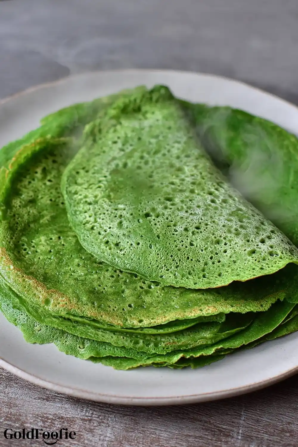 Spinach Tortilla Bright green spinach tortillas folded on a plate