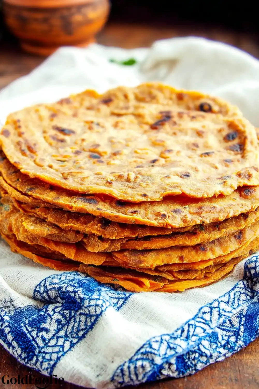 Sweet Potato Tortillas Orange sweet potato tortillas stacked on a cloth