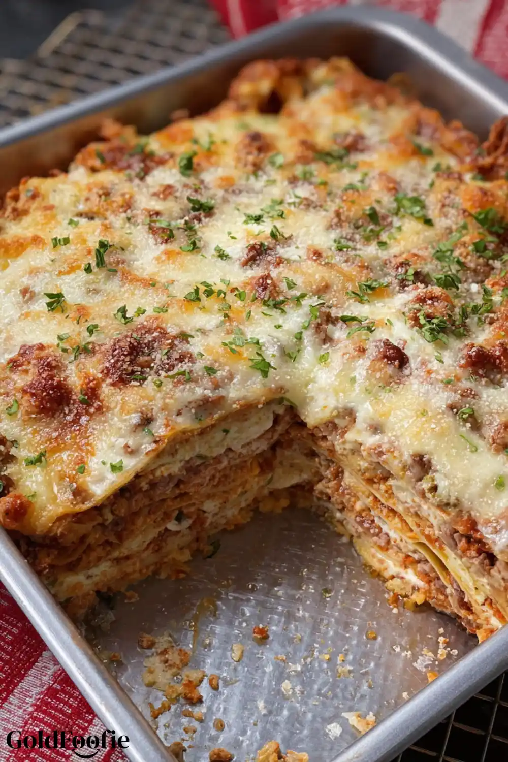 Baked Lasagna with Slice Removed Low carb tortilla lasagna in a baking dish