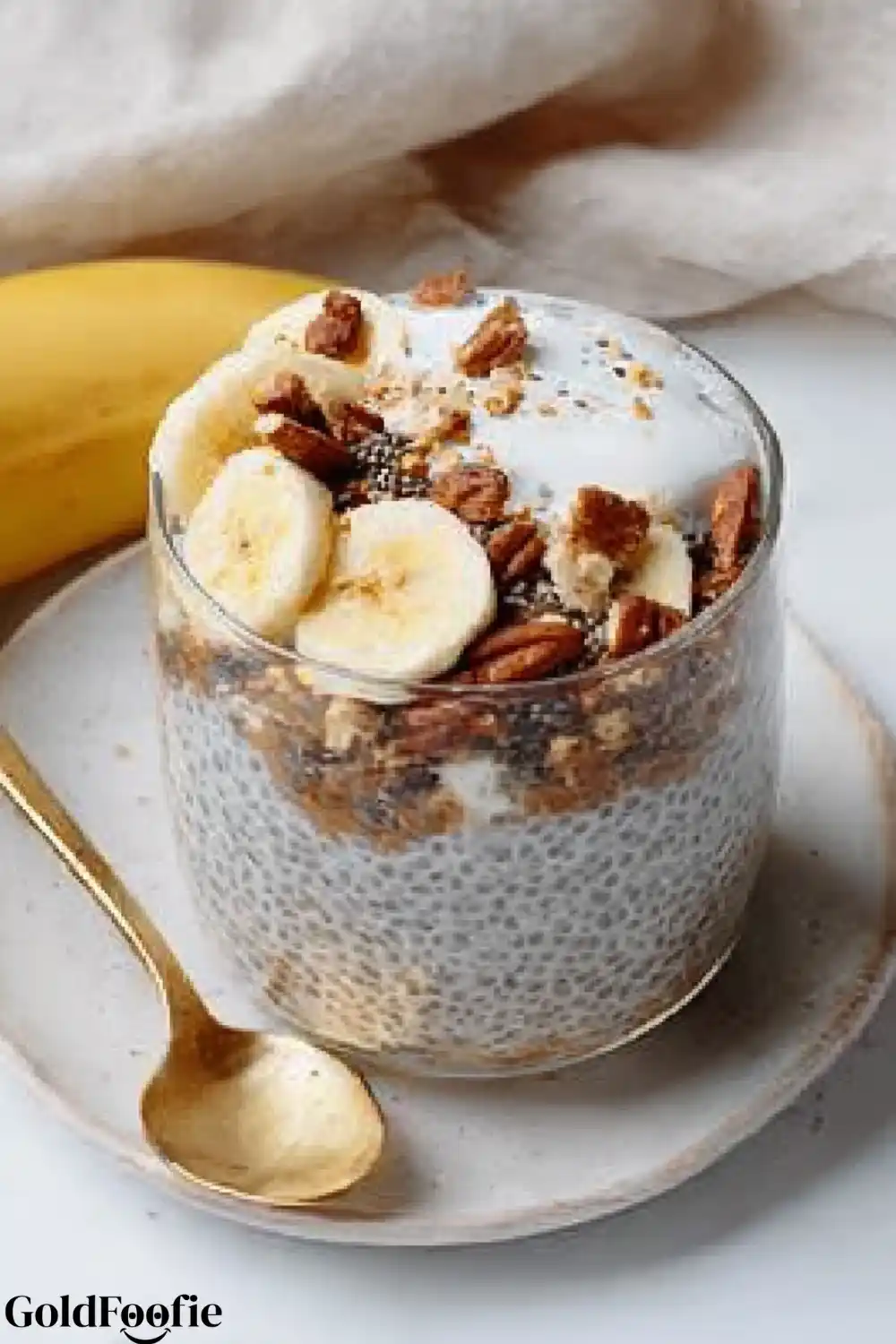 Banana Chia Breakfast Parfait Banana chia pudding parfait with yogurt, pecans, and granola