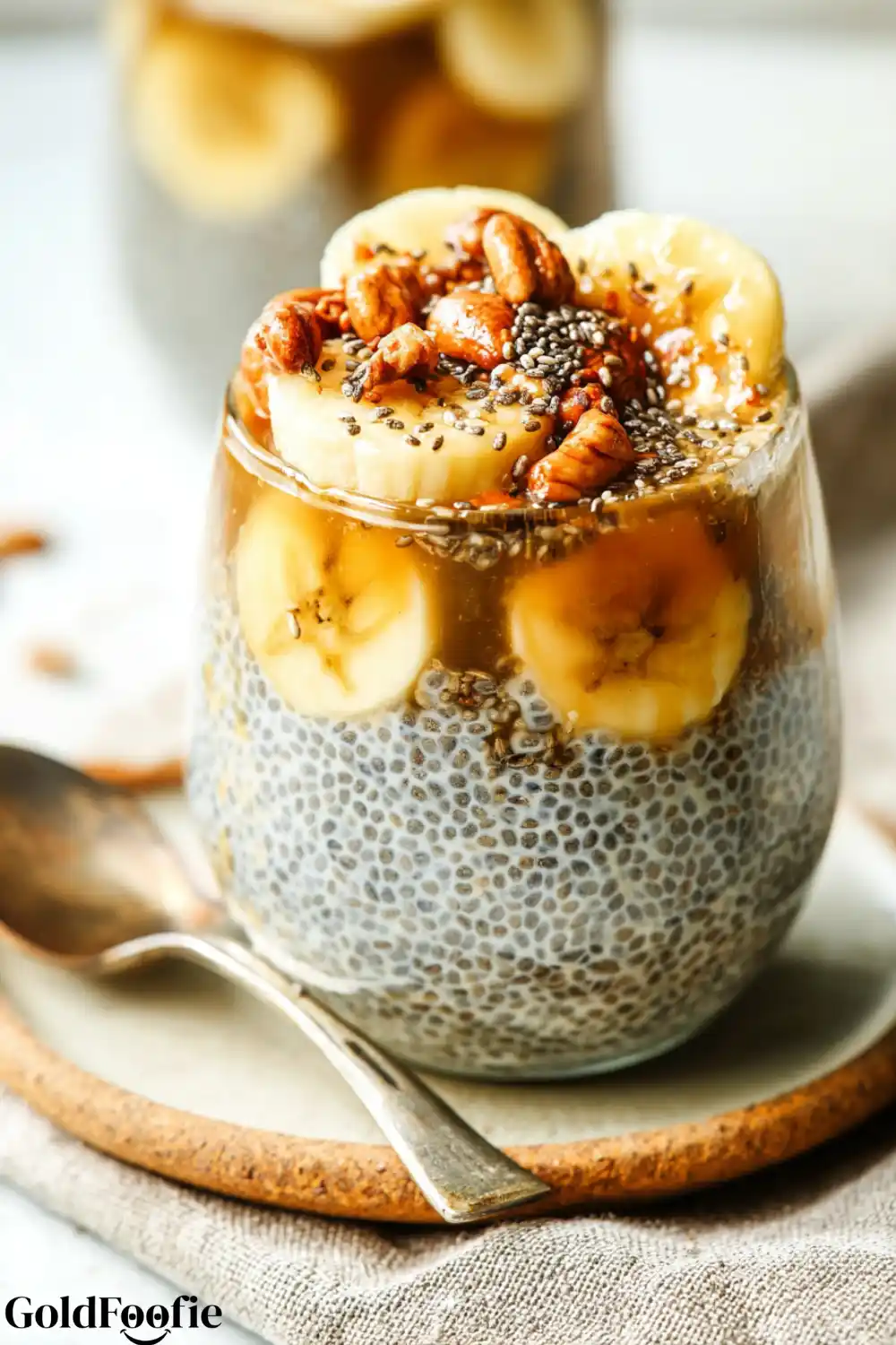 Banana Chia Pudding with Nuts Banana chia pudding topped with banana slices and chopped pecans