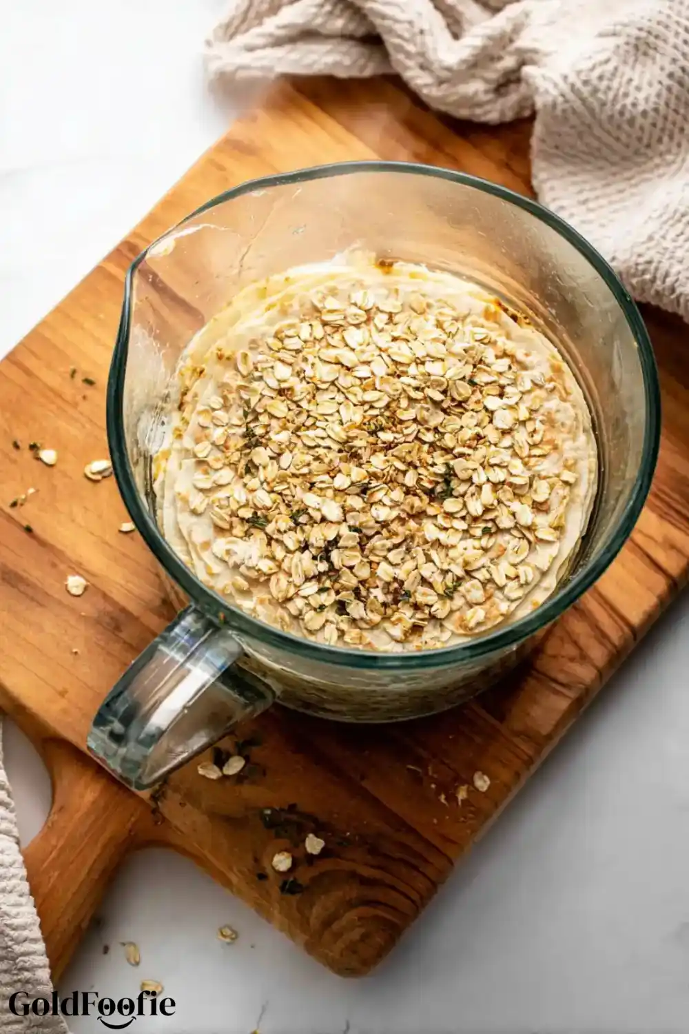 Blended Oats in Tortilla Batter Glass bowl with oats floating in tortilla batter