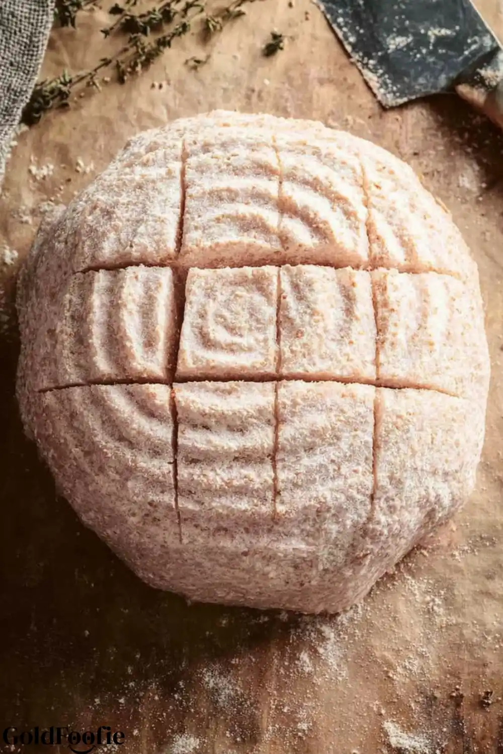 Bread Dough Ready for Baking Raw psyllium husk bread dough, floured and scored in a grid pattern.