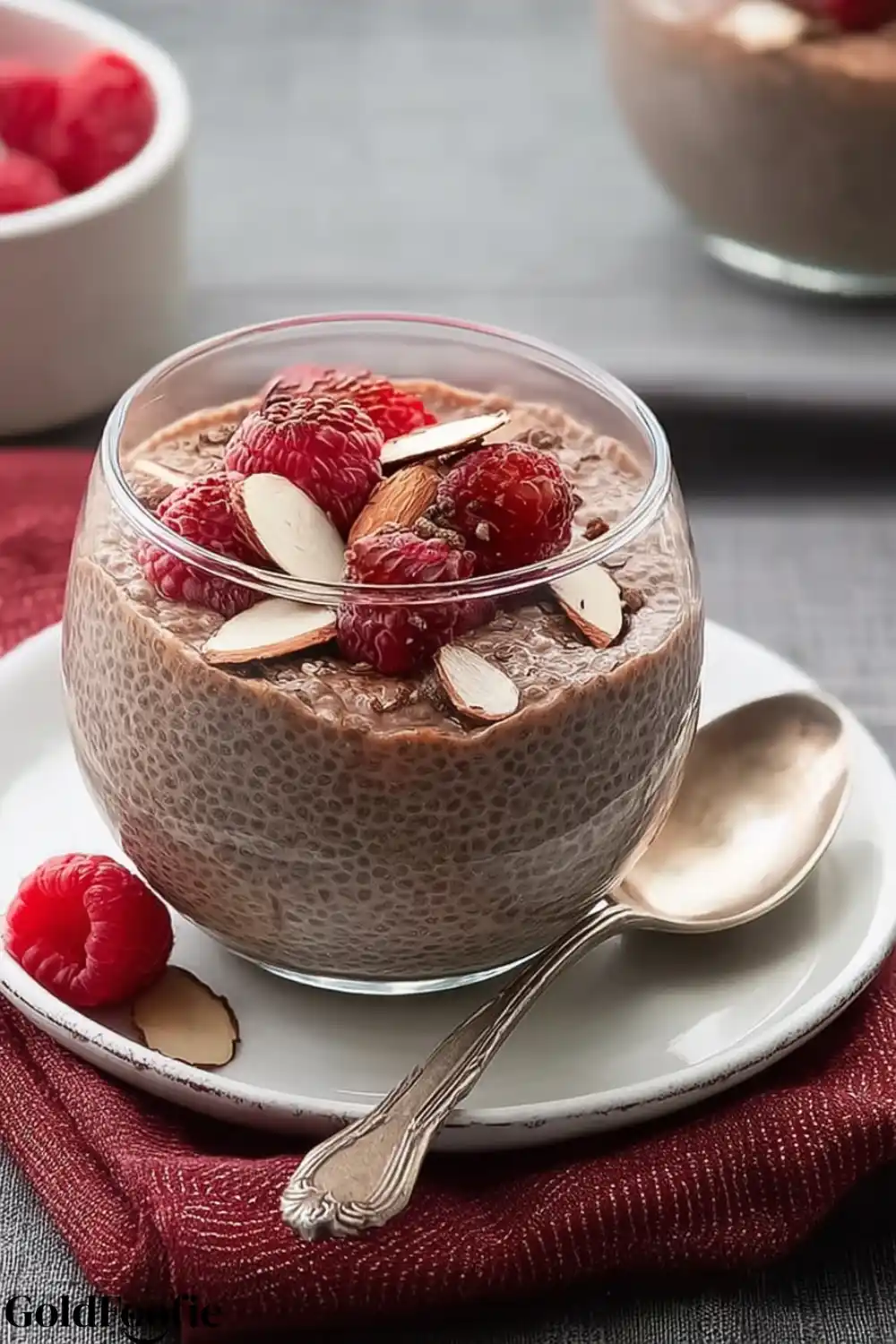 Cocoa Chia Berry Bowl Chocolate chia pudding with raspberries and sliced almonds