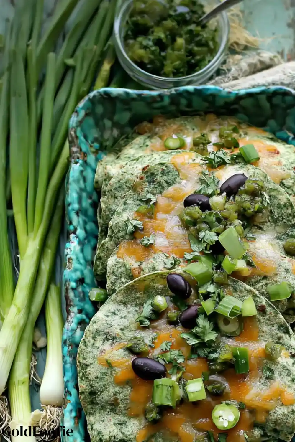 Enchiladas Made with Low Carb Tortillas Green-webp Low Carb Tortillas Green topped with melted cheese, black olives, and green onions