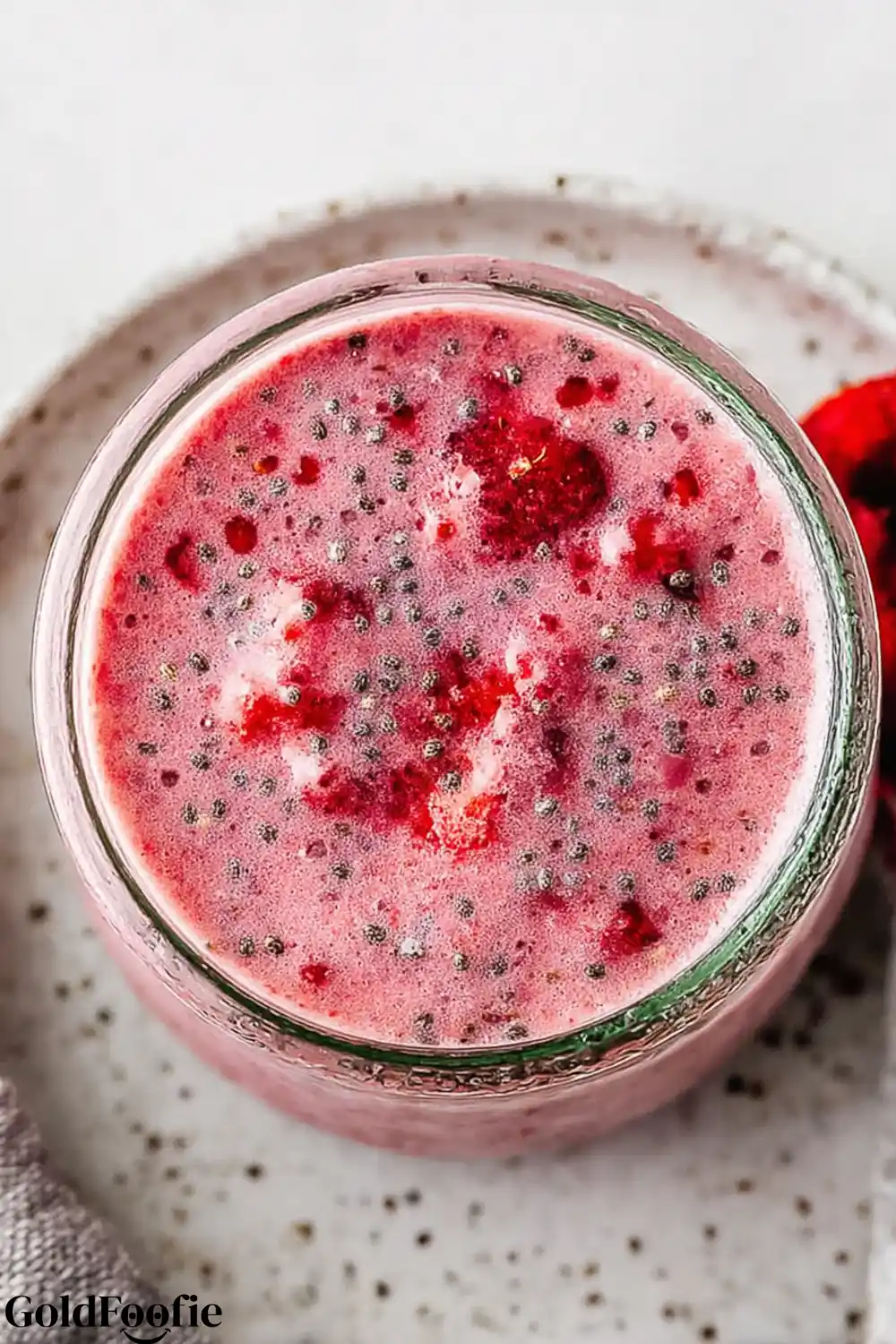Freshly Mixed Raspberry Chia Unmixed raspberry chia pudding with visible seeds and berry chunks