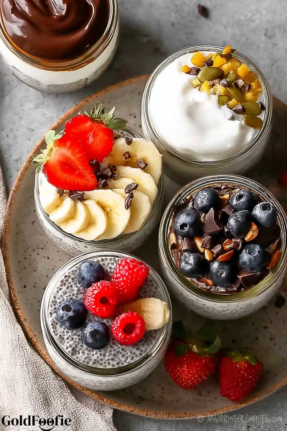 Gourmet Chia Pudding Flavors to Try Five chia puddings topped with banana, strawberries, chocolate, and seeds