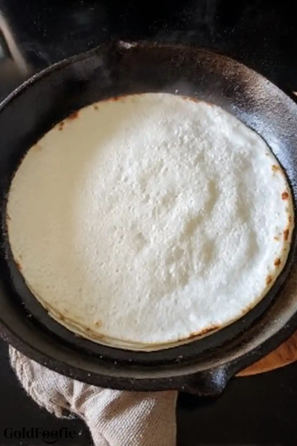 Lightly Toasting Tortilla for Better Texture Low carb tortilla in cast iron skillet