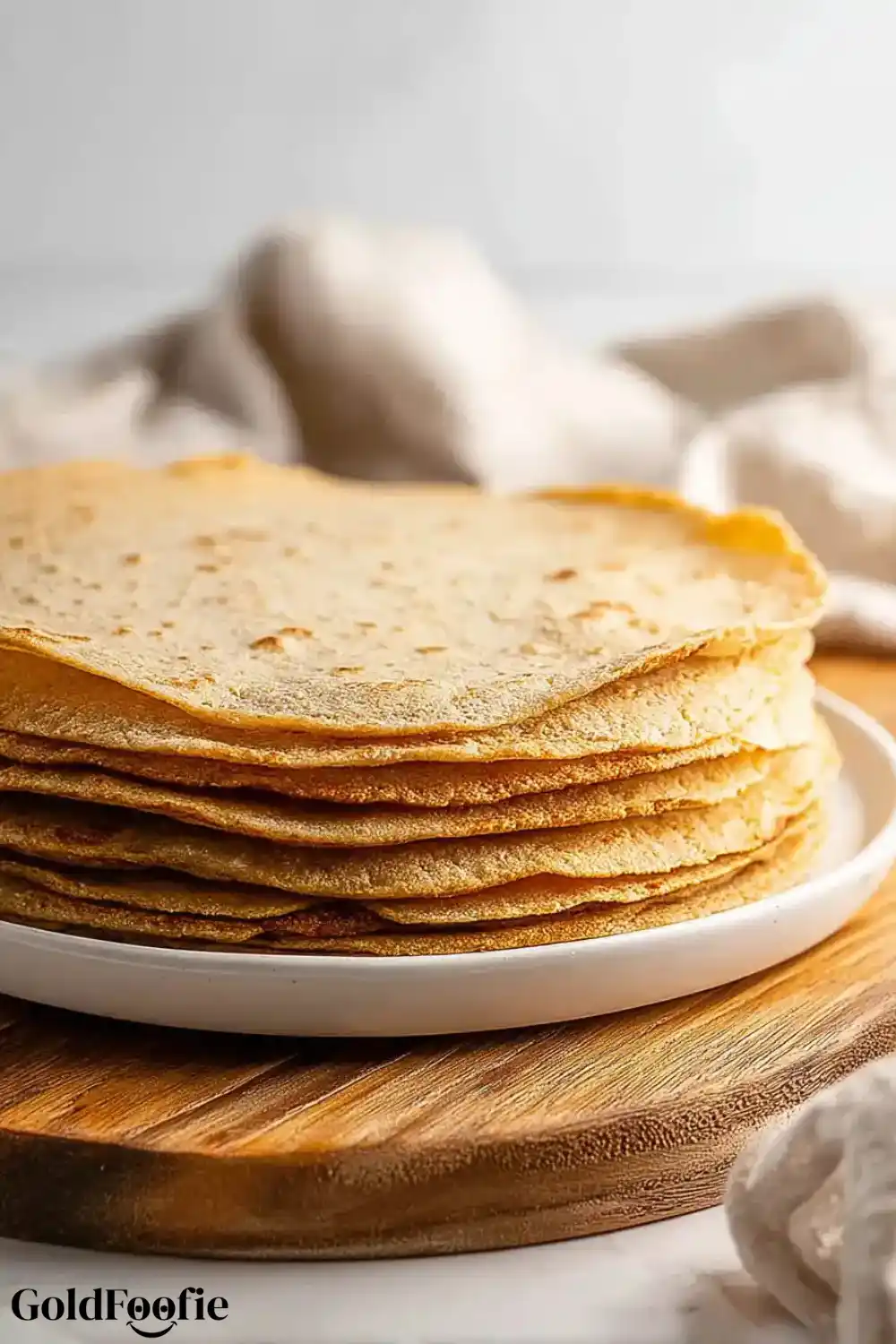 Low Carb Oat Tortillas Stack Side view of a stack of Low Carb oat tortillas on a white plate