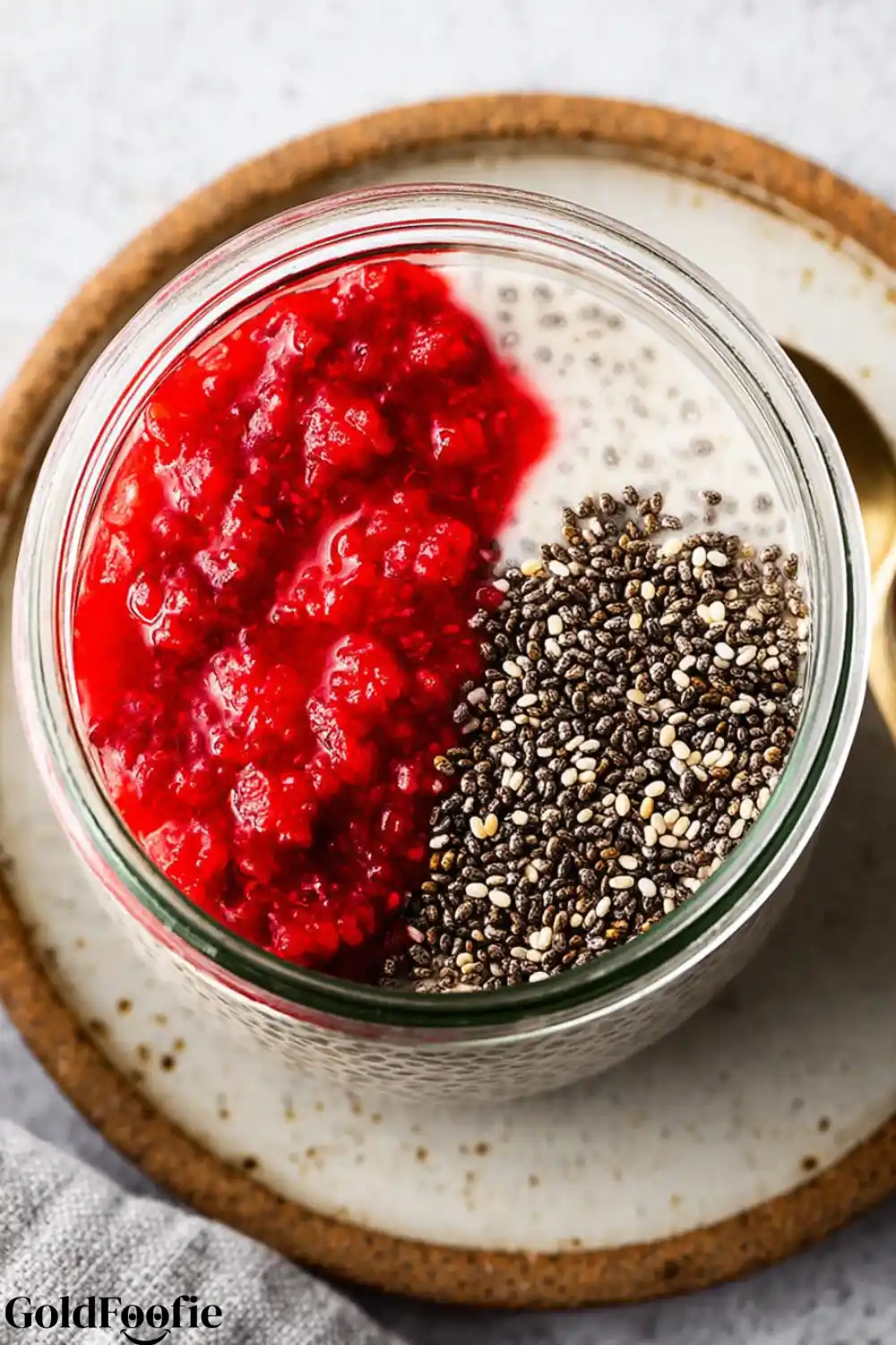 Raspberry Purée Chia Mix Chia seeds and raspberry purée in a glass jar