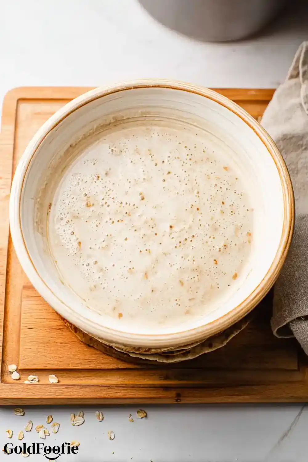 Rested Oat Tortilla Batter Foamy oat batter resting in a ceramic bowl