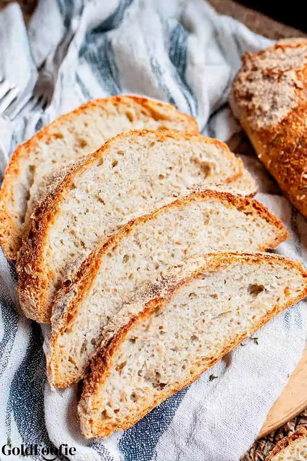 Sliced Psyllium Husk Bread Four slices of psyllium husk bread on a towel, showing the soft crumb.
