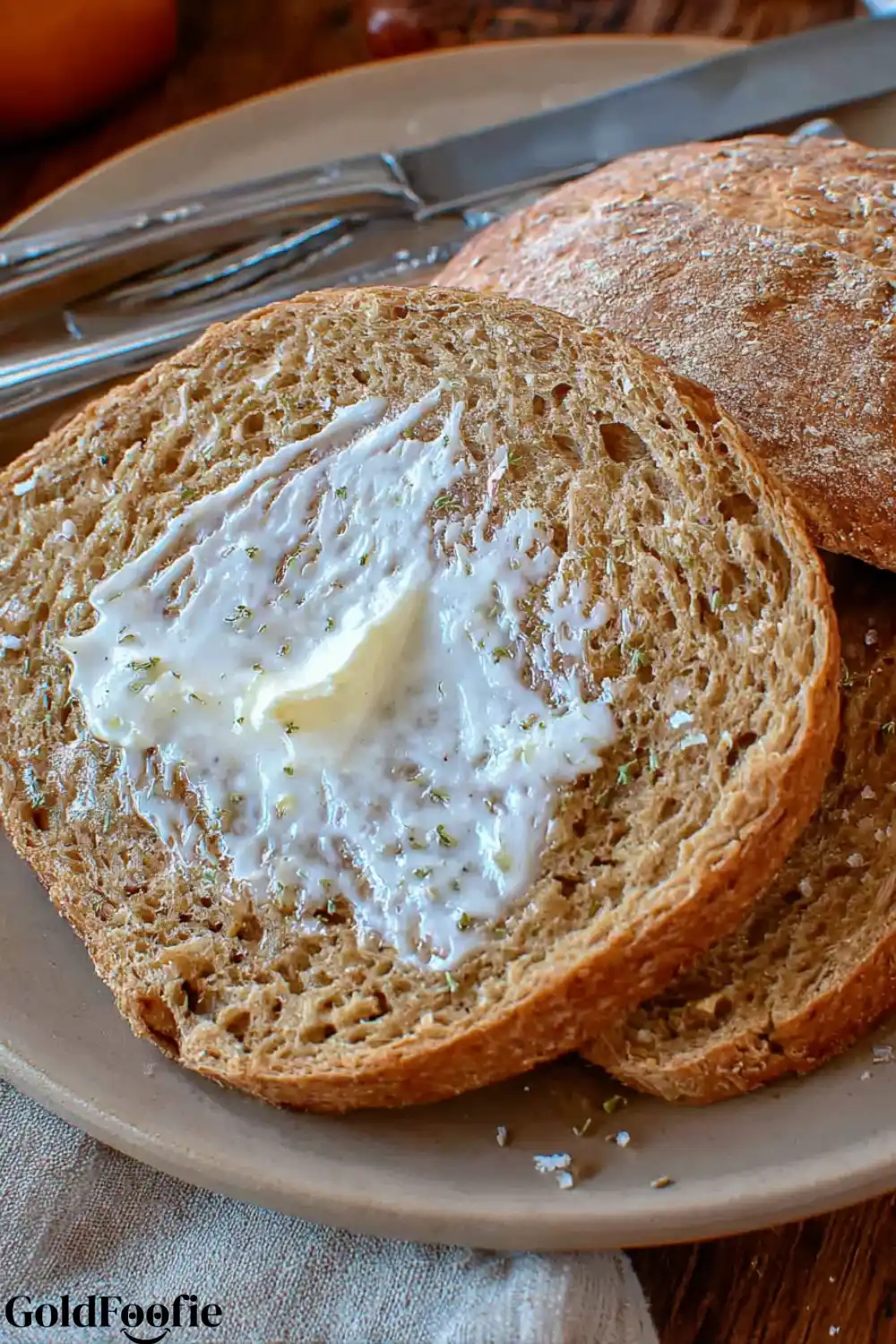 Toasted Low-Carb Slices Two slices of buttered low-carb bread on a plate.