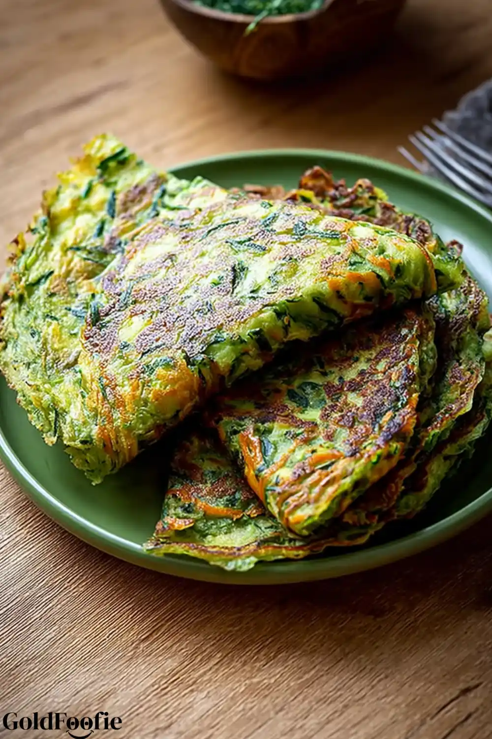 green tortilla recipes. Zucchini and spinach tortillas folded on a green plate