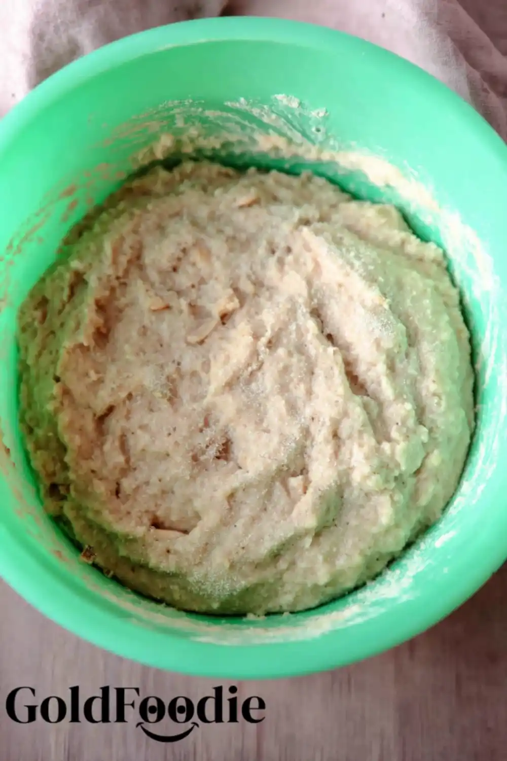 Almond Bread Batter Almond bread dough in a green bowl before baking