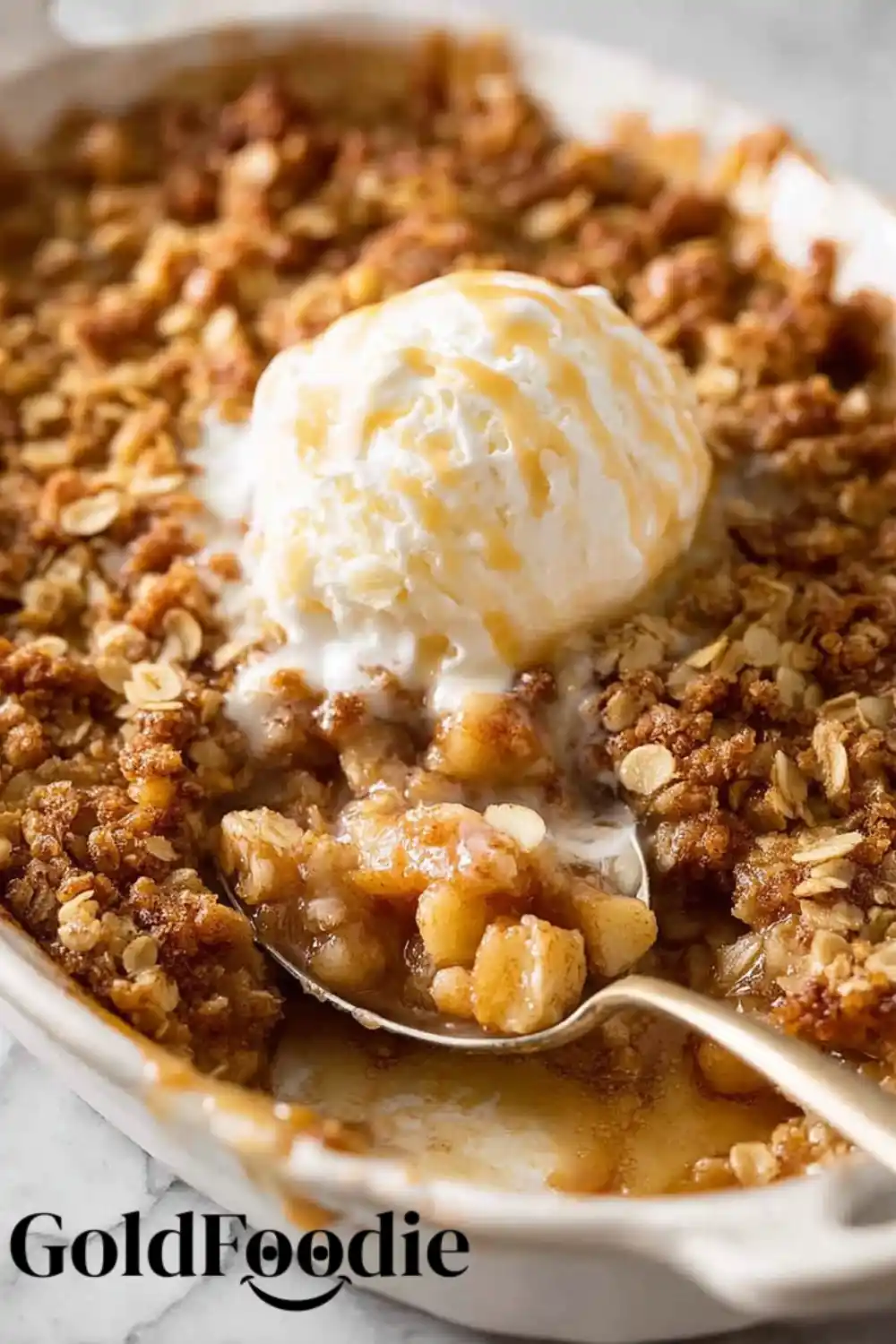Apple Crumble Scoop Spoon scooping apple crumble with ice cream