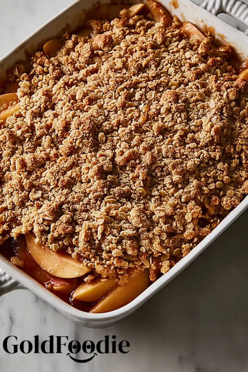 Baked Apple Crisp in Dish Whole baked apple crisp in a white baking dish
