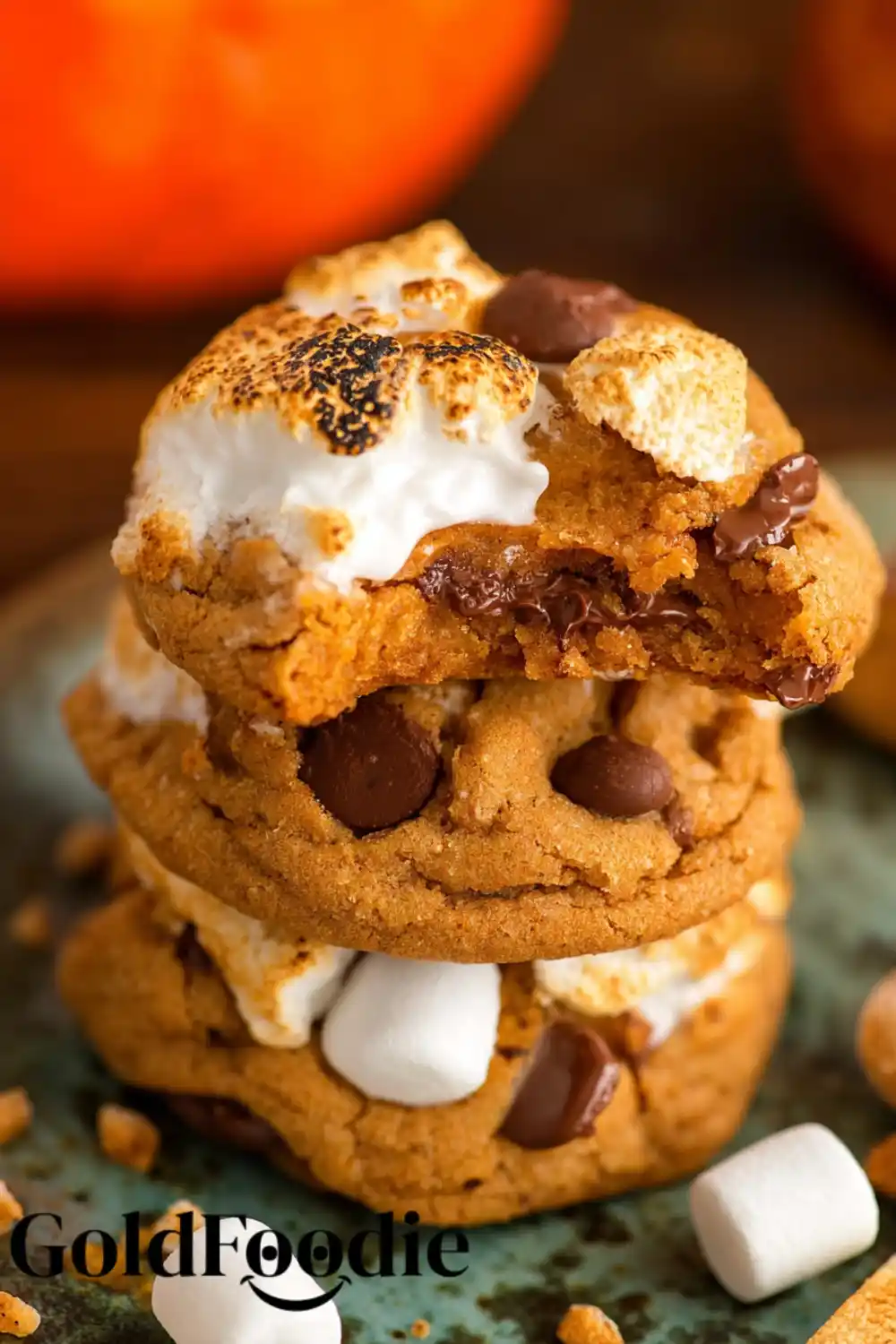 Bite of Pumpkin S'mores Cookie Cookie with bite taken out, revealing soft melted interior