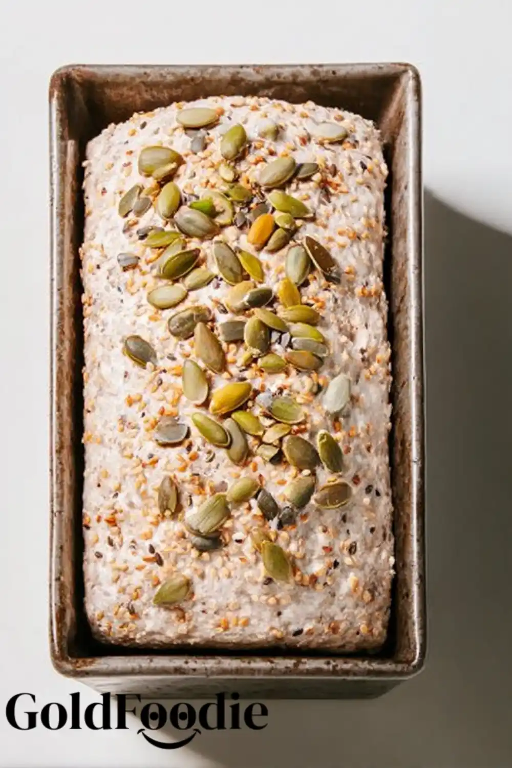 Buckwheat Bread Dough in Pan Seeded Buckwheat Bread dough in loaf pan before baking.
