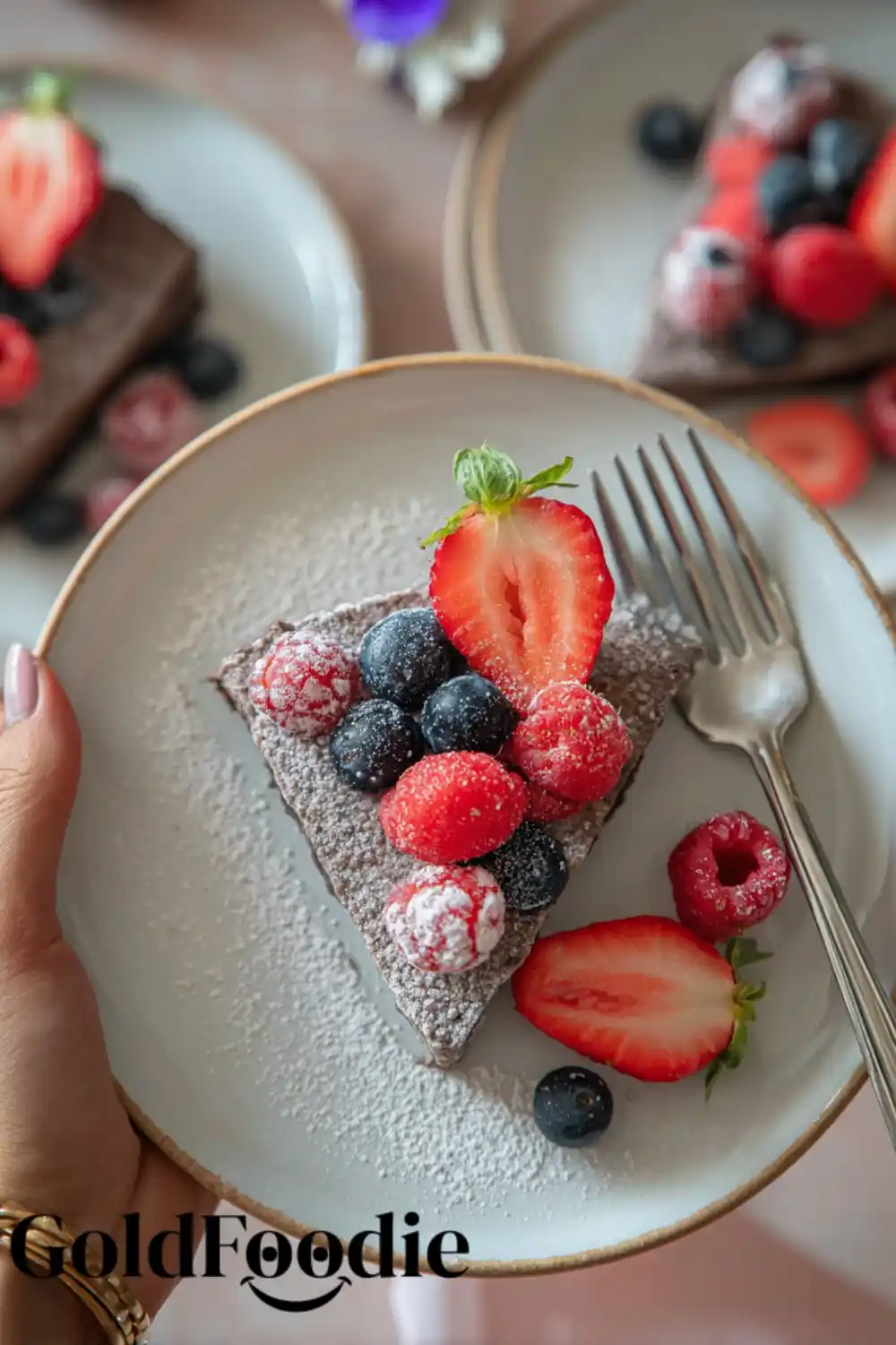 Chia Cake Slice with Fresh Fruit Triangle slice of chia seed cake with fruit and powdered sugar