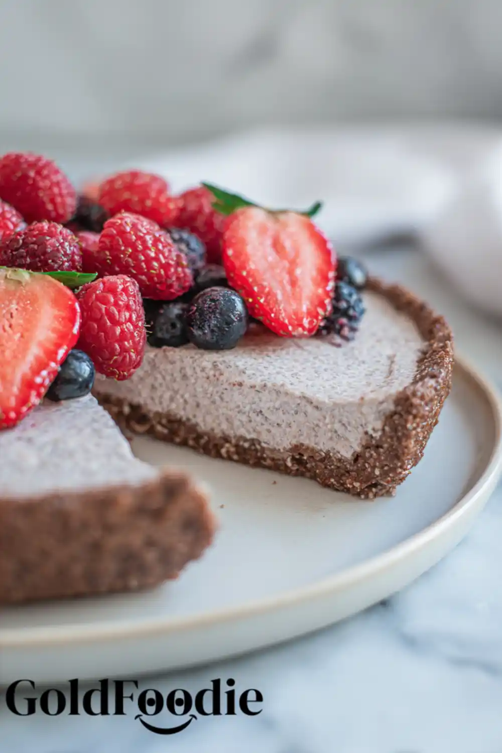 Chia Cake with a Slice Removed Vegan Chia seed cake with cut-out slice and fresh berries
