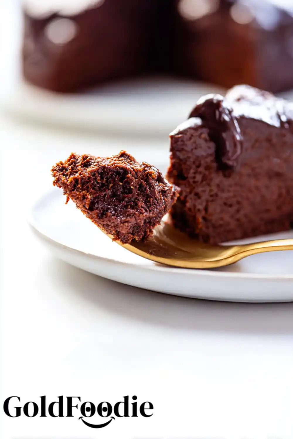 Chocolate Chia Cake Fork Bite Close-up of moist chocolate chia cake bite on gold fork