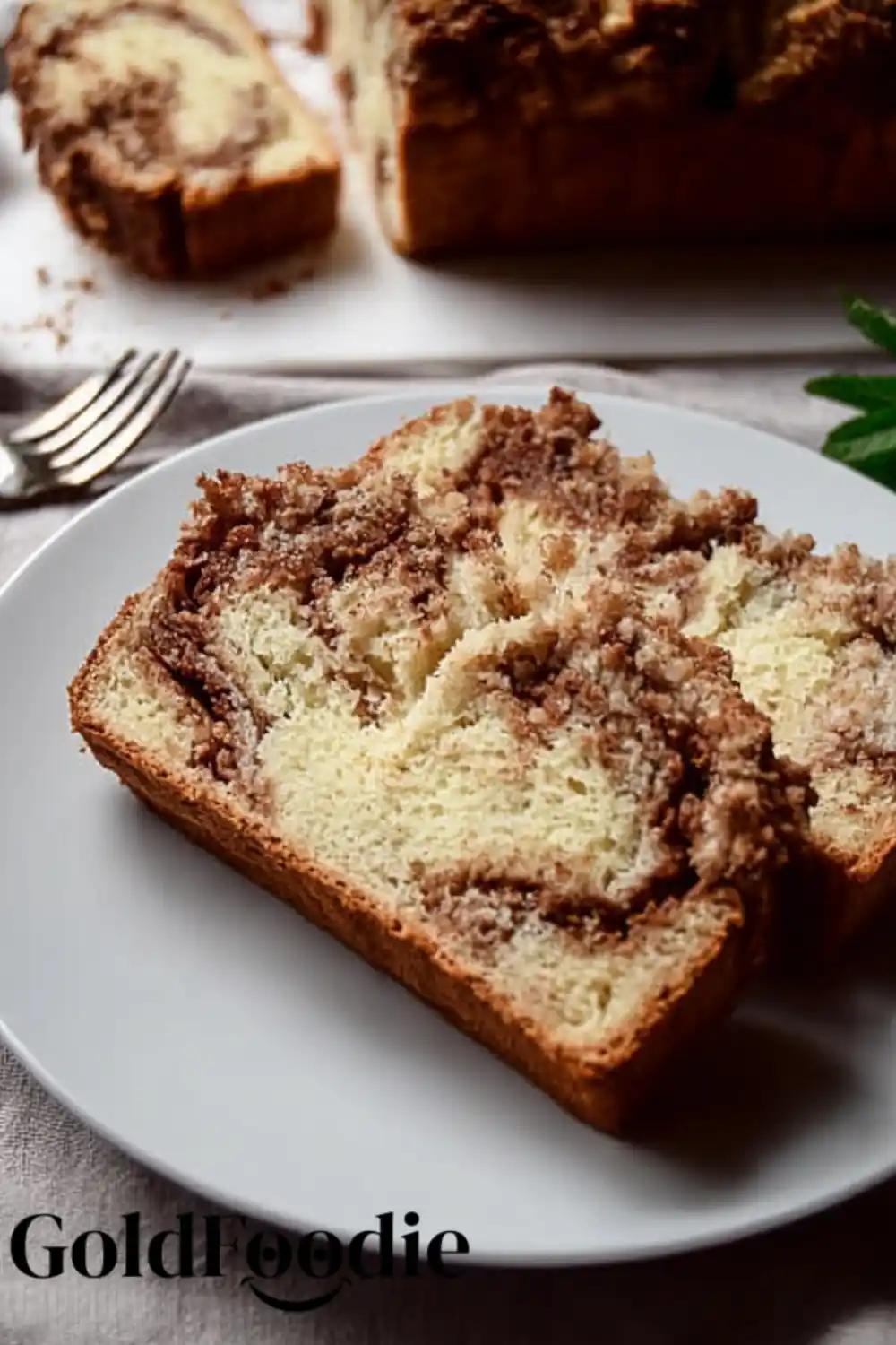 Cinnamon Bread Slice Slice of gluten-free vegan cinnamon swirl bread on plate.