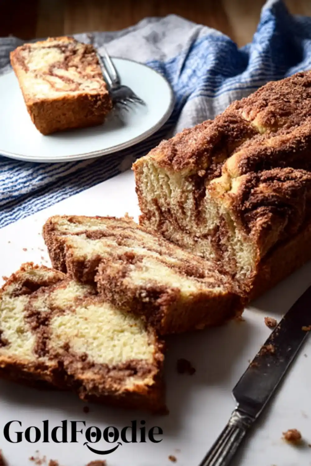 Cinnamon Swirl Bread Serving Cinnamon swirl bread sliced on serving board.