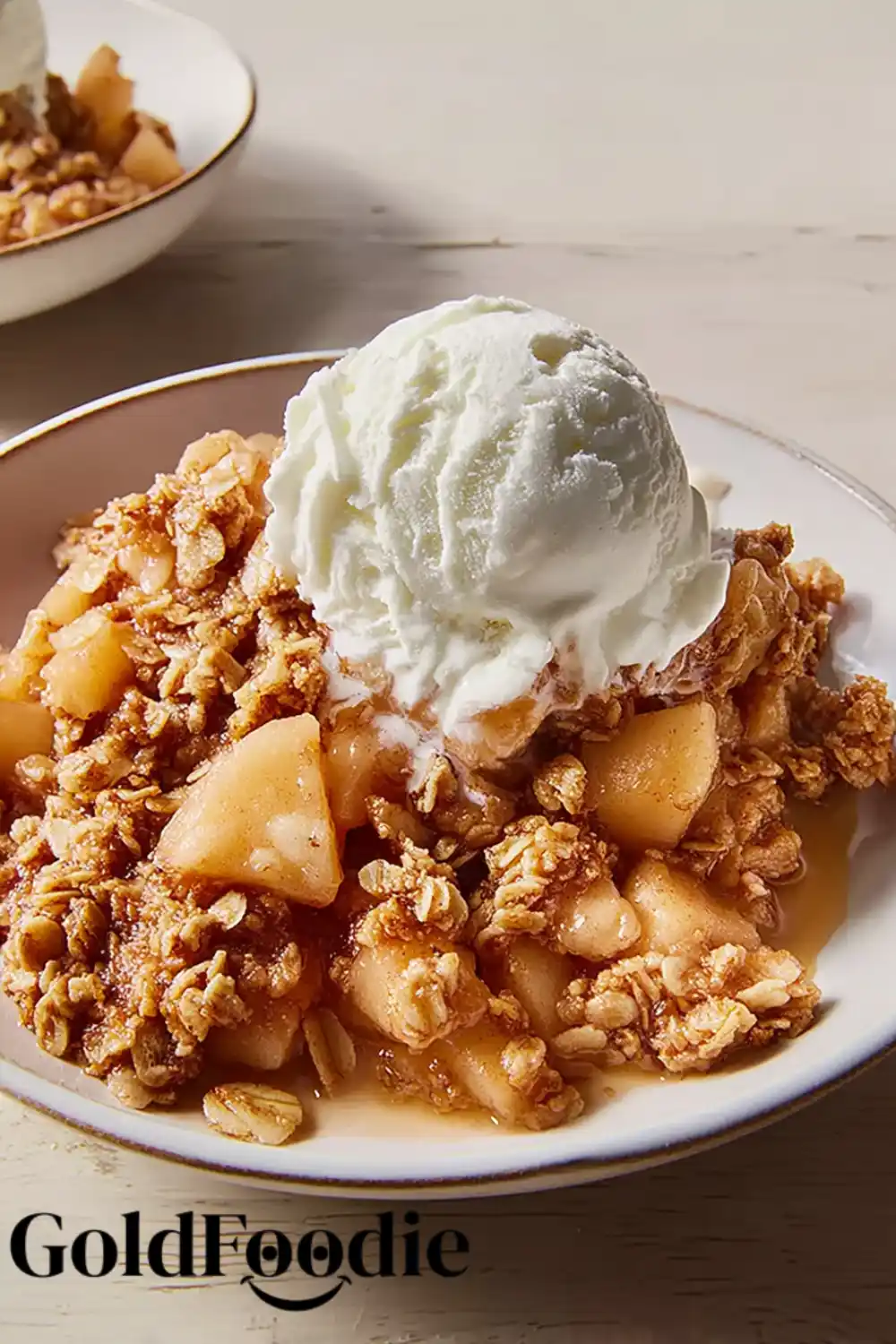 Old-Fashioned Apple Crisp 5 Close-up of apple crisp and melting ice cream