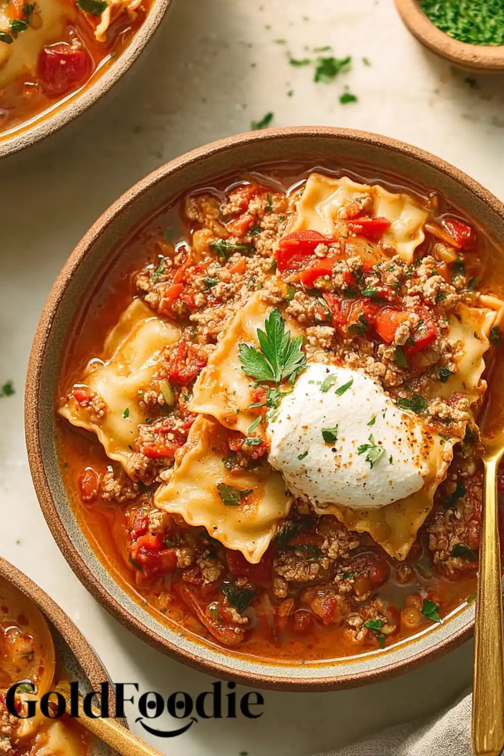 Classic Lasagna Soup Presentation Bowl of gluten-free lasagna soup with golden spoon