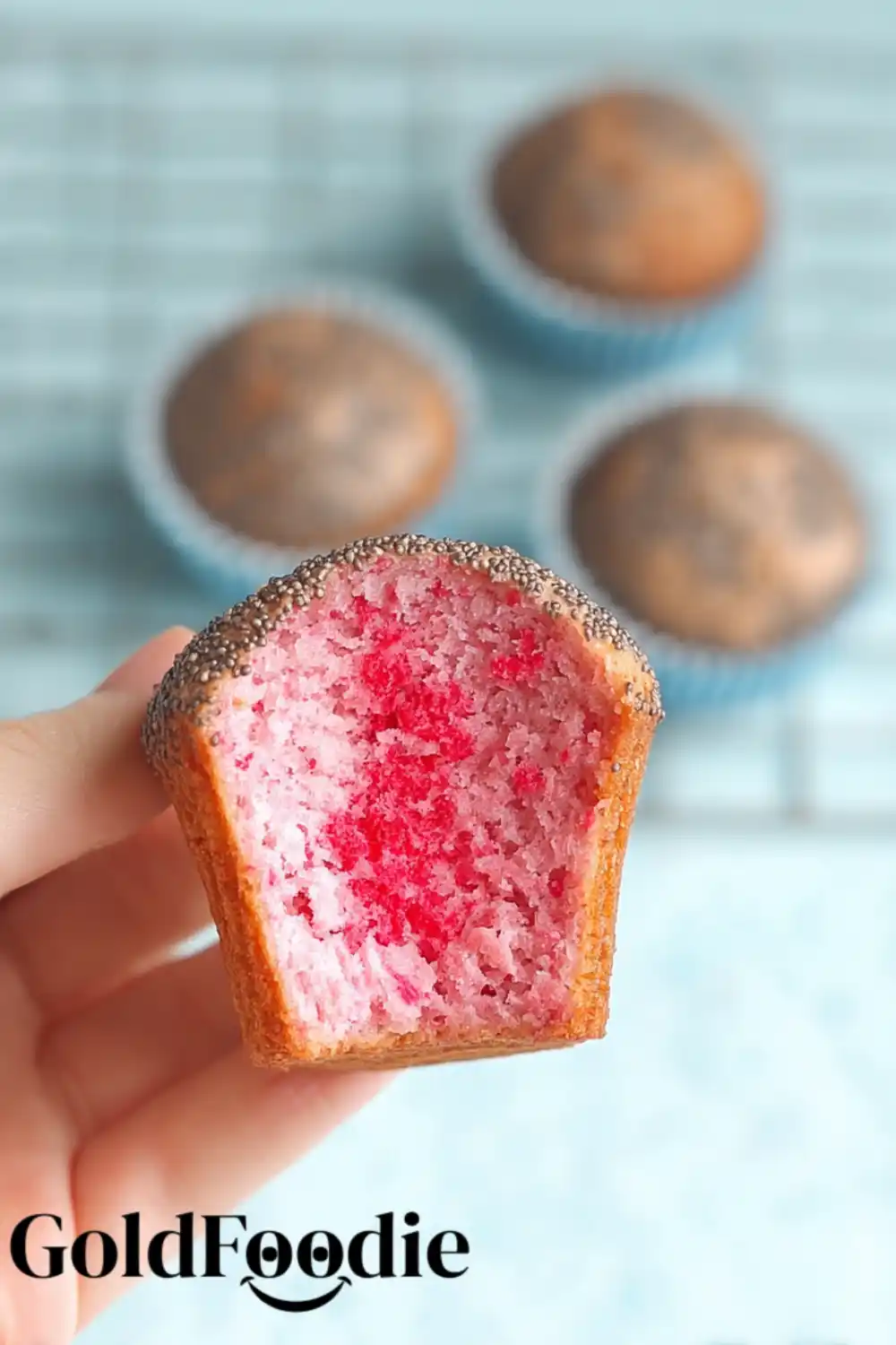 Cooling Chia Seed Cake Mix Cupcakes Hand displaying the texture of a cupcake made with chia seed cake mix.