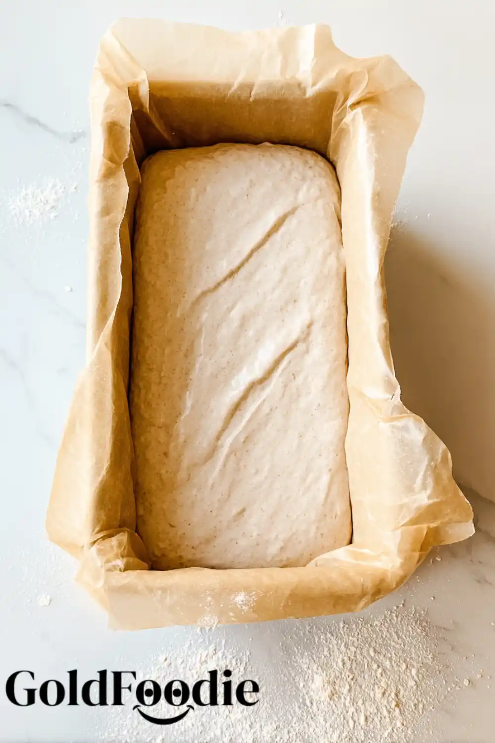 Dough in Pan Oat flour bread dough in a loaf pan before baking.