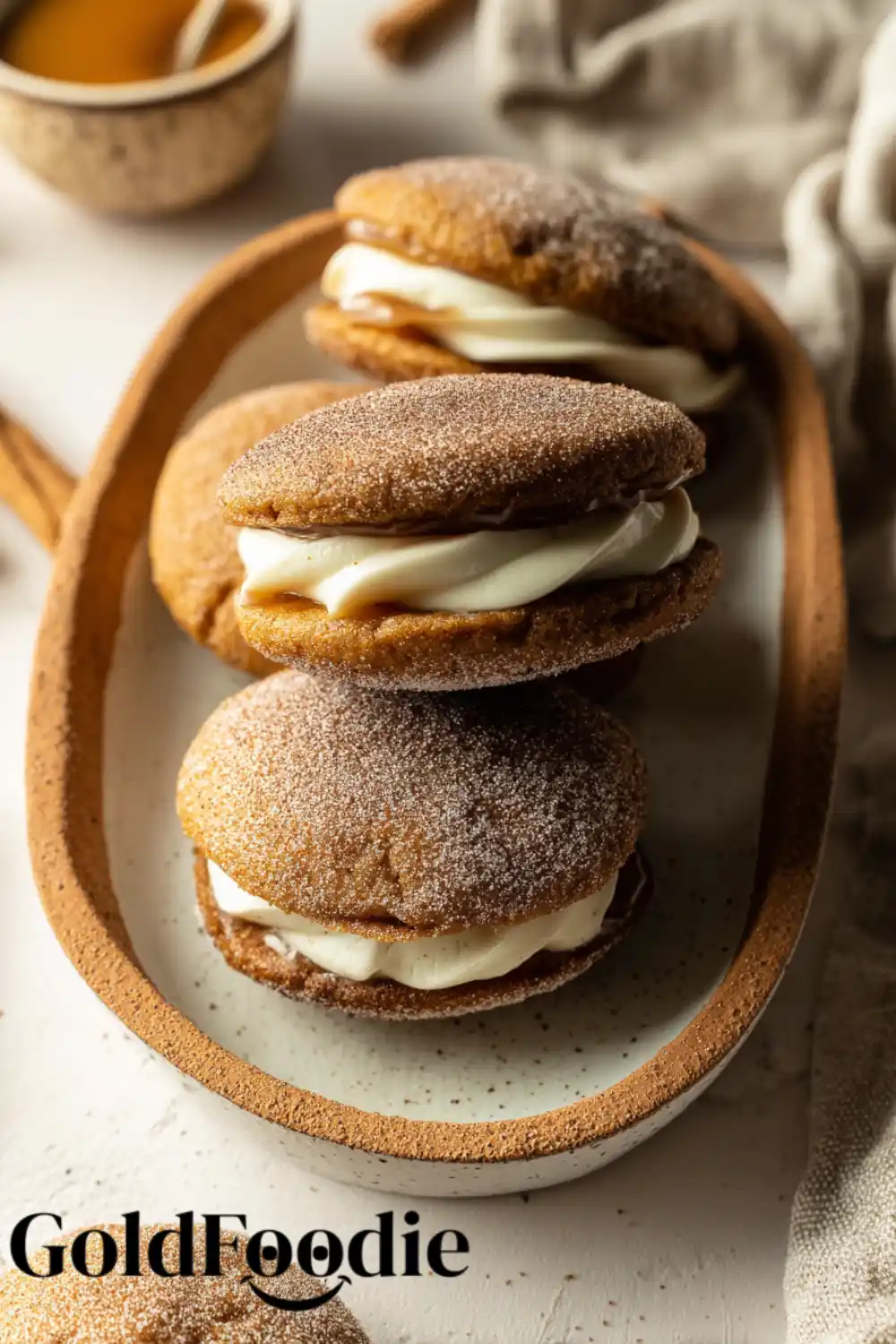 Filled Whoopie Pies Cream-filled apple cider whoopie pies on a ceramic plate