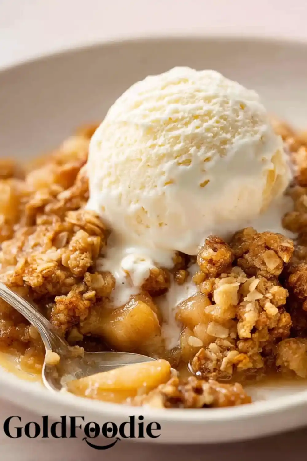 Freshly Baked Crumble Baked apple crumble in a dish with vanilla scoop