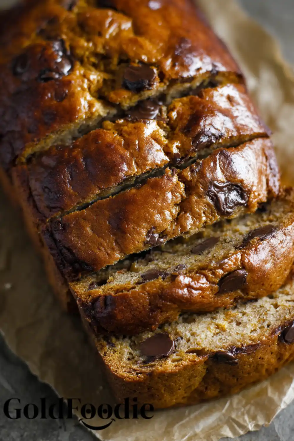 gluten free vegan pumpkin yogurt bread 5 Sliced pumpkin yogurt bread loaf with glossy finish and chocolate chips.
