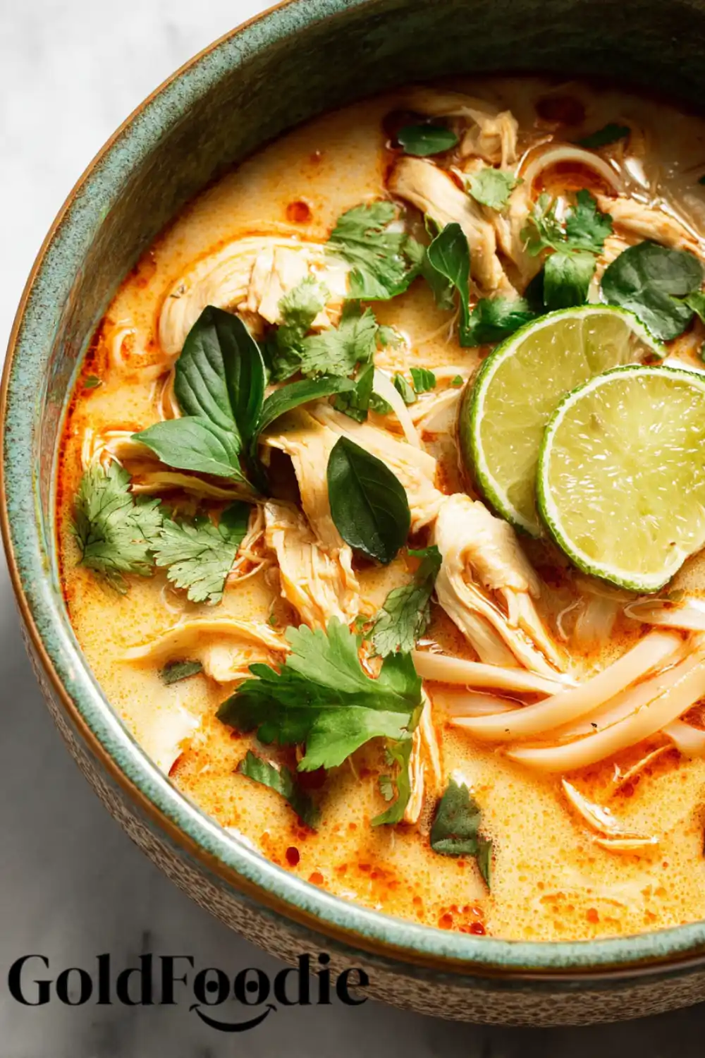 Simple Thai Chicken Soup 5 Thai chicken soup with lime slices and fresh cilantro